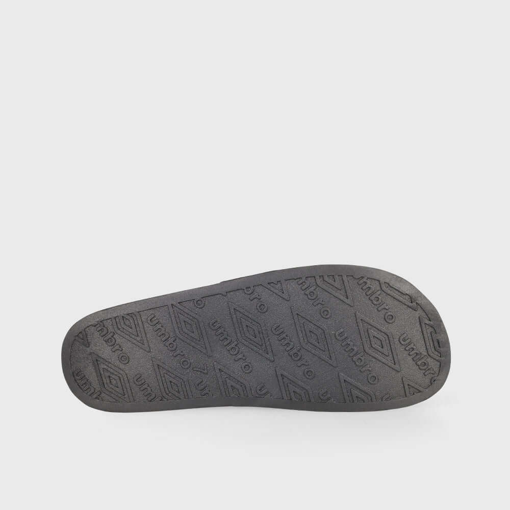 Bottom view of Umbro unisex sport slides in black, showcasing the textured outsole for grip and durability.