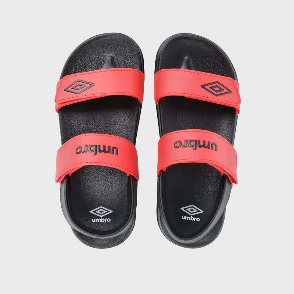 Top view of Umbro Kids Embossed Strap Sandals in red, featuring two adjustable straps and cushioned footbed for comfort.